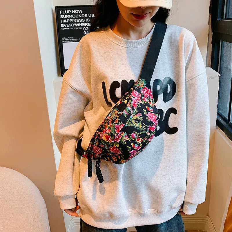 Women's western style waist bag with large floral decoration and contrast stitching