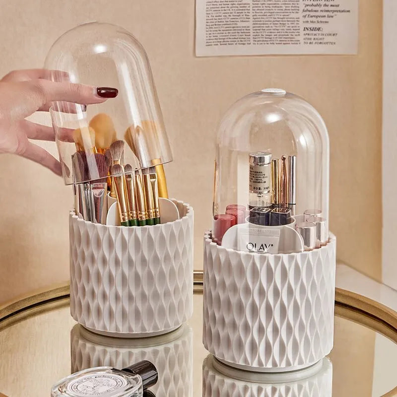 White transparent acrylic makeup brush holder with lid on a desktop, showing rotating base.