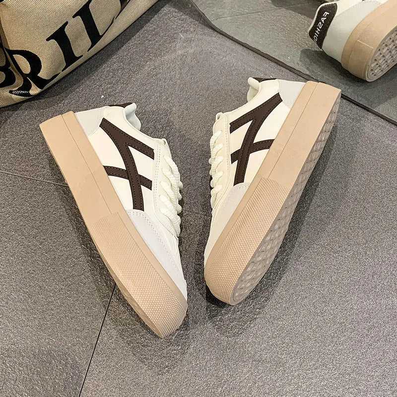 Women's blue and brown casual sports shoes with artificial PU leather upper and front lace-up fastening