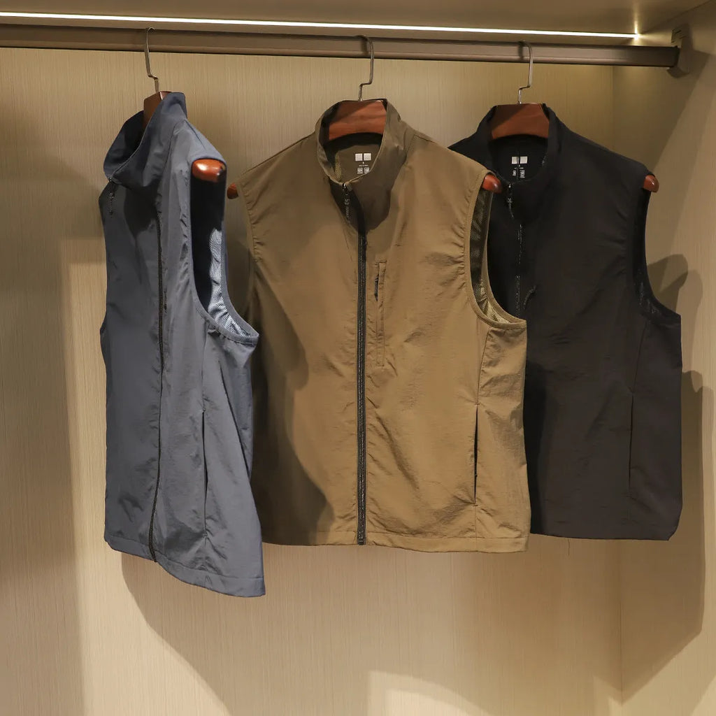 Men's straight-cut nylon vest in army green with side seam pockets and bandage-style detailing.