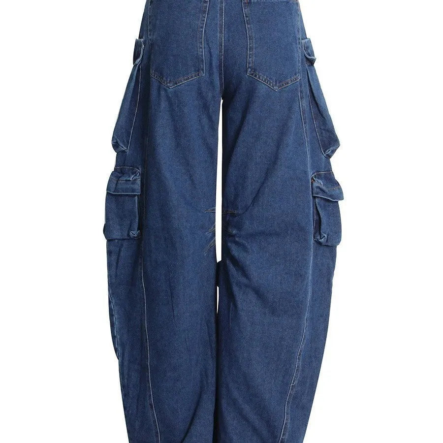 Dark blue distressed women's jeans with a high waist, wide legs, and multiple workwear-style pockets.
