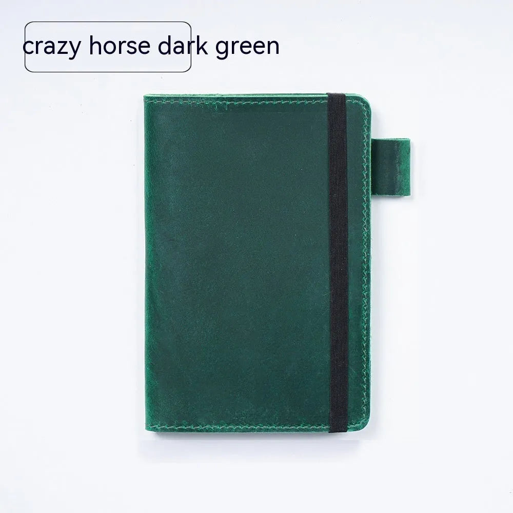 Handmade cowhide kraft notebook open showing wood-free paper with dark green cover option