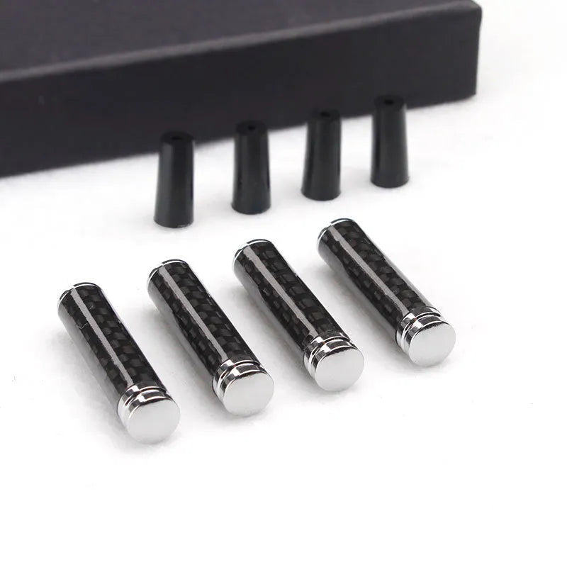 Set of four carbon fibre car door handle covers for universal fit installation.