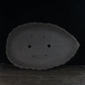 Handmade purple clay flower pot showing traditional craftsmanship and floor-standing design