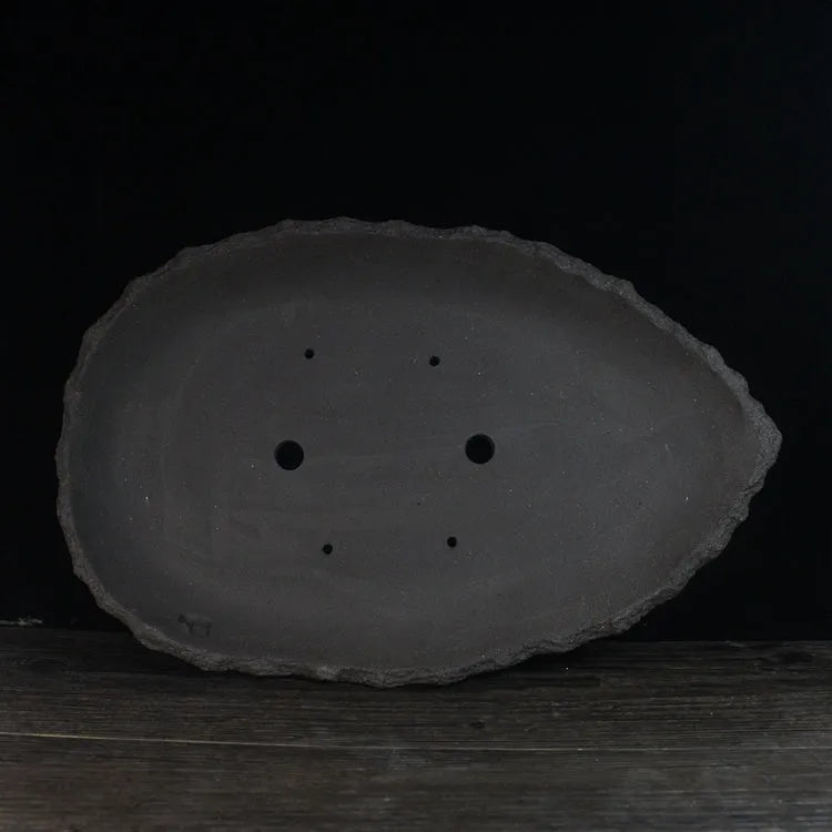 Handmade purple clay flower pot showing traditional craftsmanship and floor-standing design