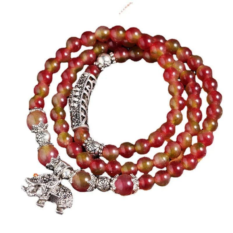 Handmade watermelon crystal bracelet with Chinese knot and elephant beads in 6mm or 8mm size.
