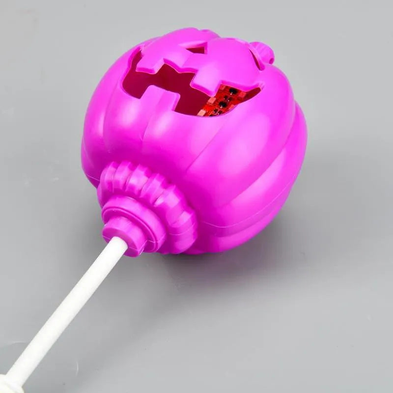 Plastic pumpkin lamp with yellow or purple light option, USB charging, 8.3cm wide by 22cm tall