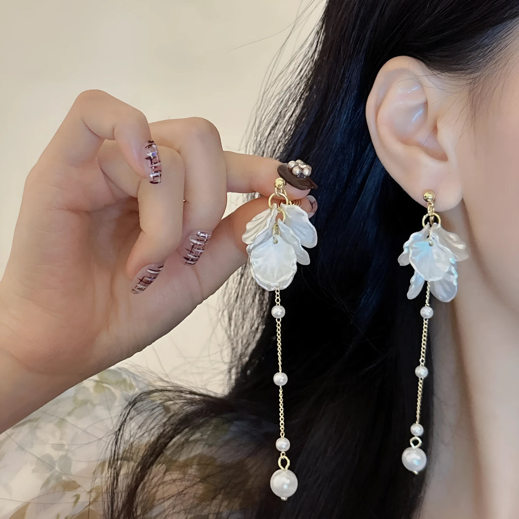 Women's acrylic shell pearl tassel earrings with multiple clip options showing 8.8cm length