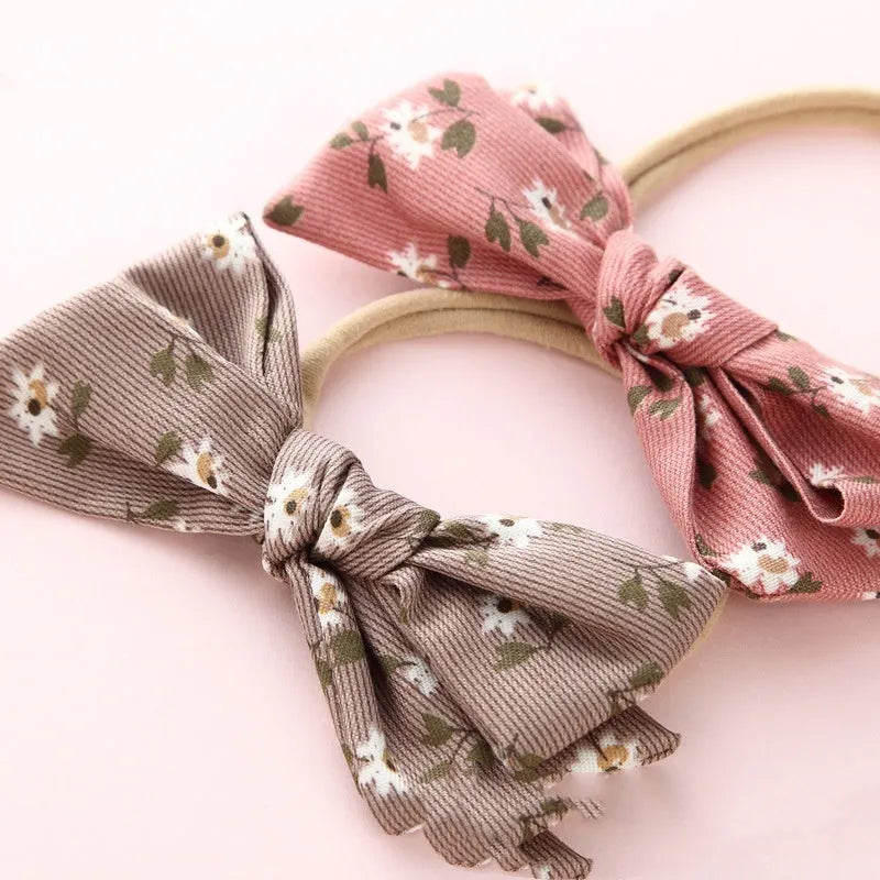 Children's knotted bow hair band in cloth with printed bow detail, Princess series Snow White style, six colours available