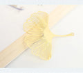 Brass metal bookmark with hollow leaf design and rose gold tassel