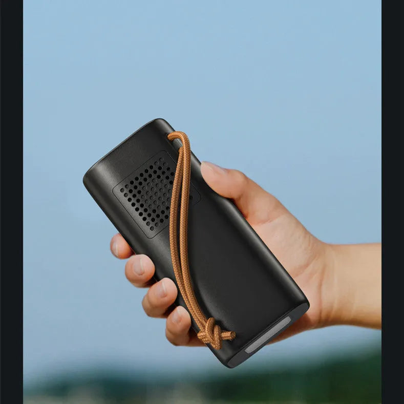 Black portable power bank with solar charging panel, 200W output capacity for outdoor emergency power supply