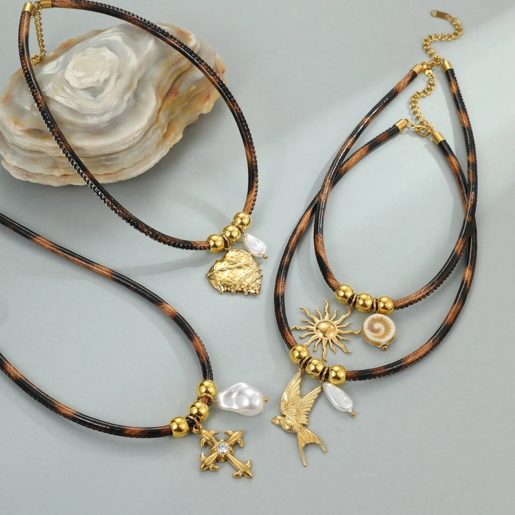 Leopard print geometric pendant on stainless steel necklace with gold-plated accents