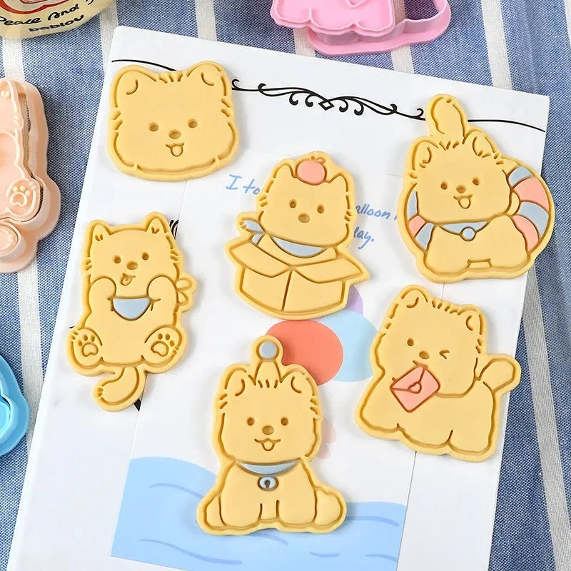 Plastic 3D biscuit mould with cartoon puppy designs including birthday hats and swimming rings
