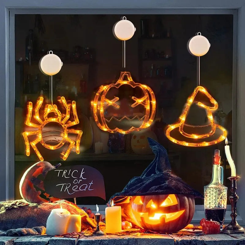Halloween battery-powered LED window lights with suction cups showing spider, pumpkin and ghost designs