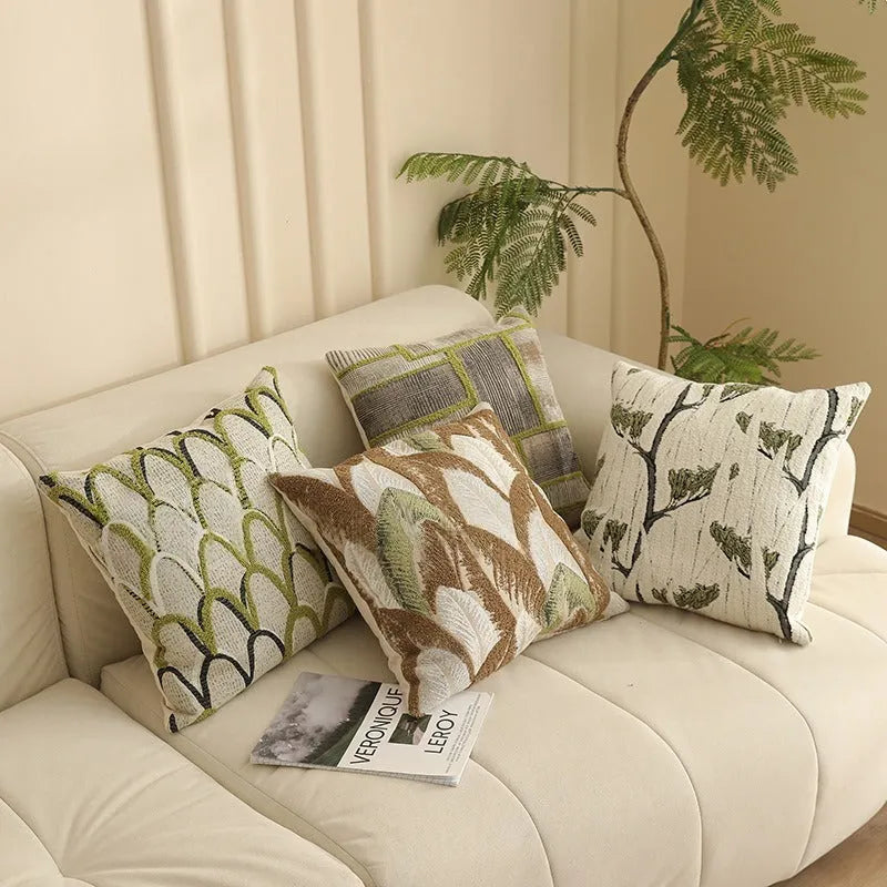 Square pillow cover with woven plant pattern in Nordic style, shown on a sofa as a waist pillow.