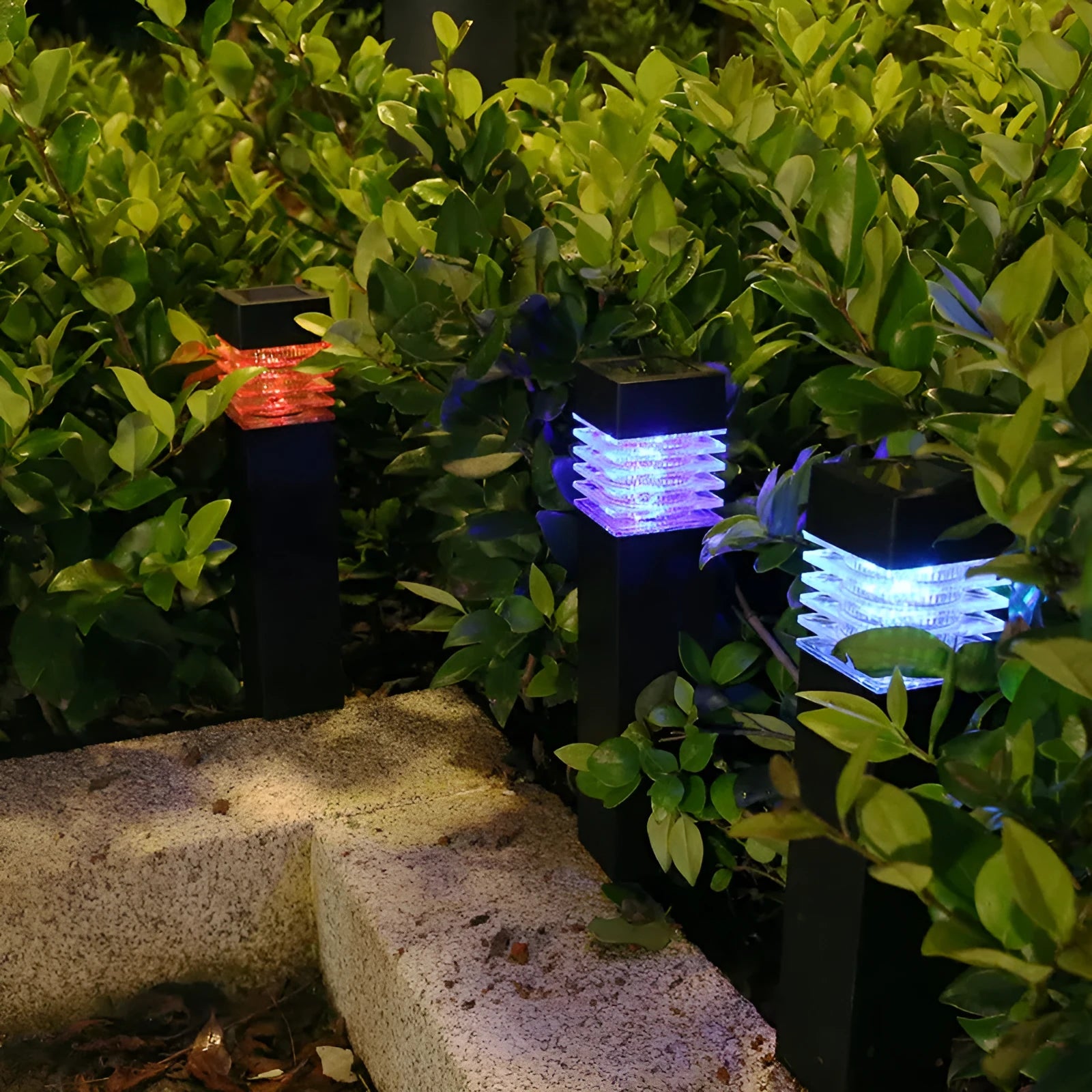 White cuboid solar-powered ground lamp for garden and pathway lighting.