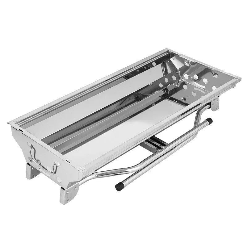 Large stainless steel folding barbecue grill with black cooking grate, shown outdoors.