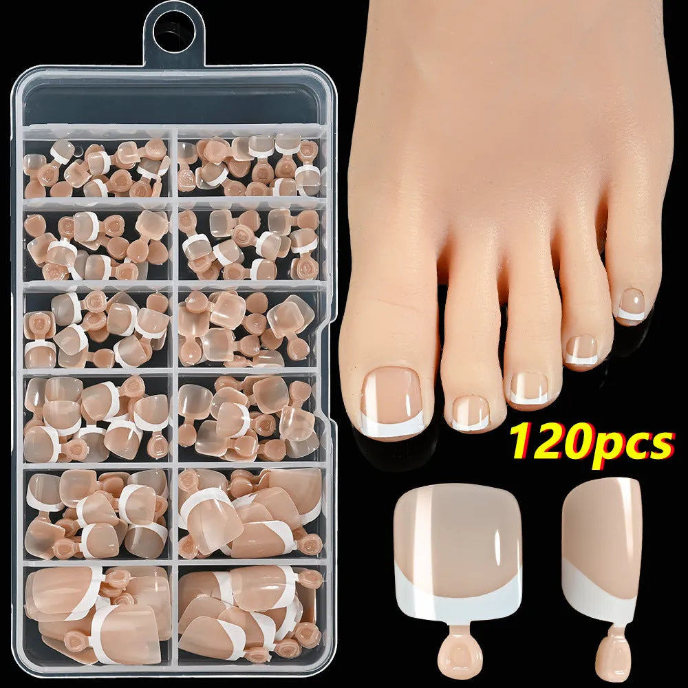 120 piece box of square short French style artificial toe nails with white tips on nude base.