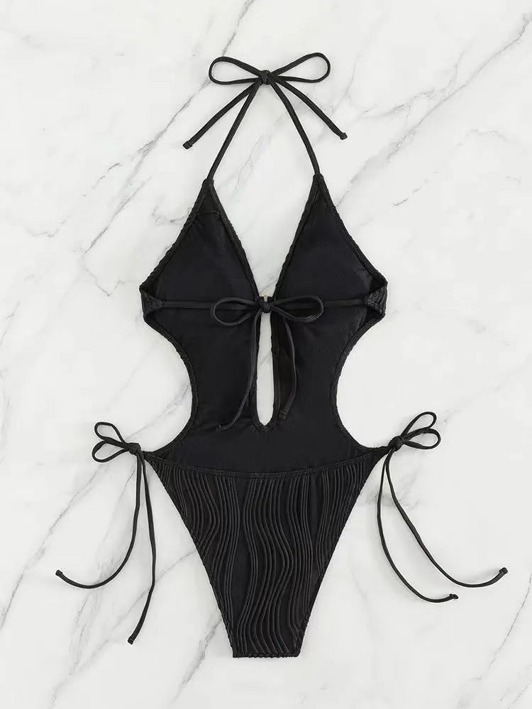 Women's black lace-up triangle bikini swimsuit with adjustable front on mannequin