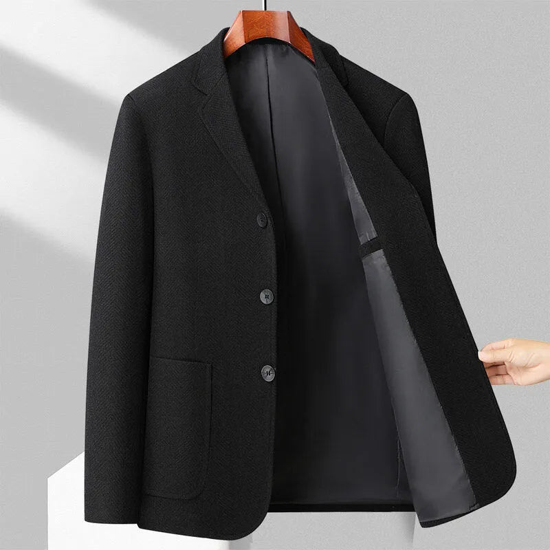 Men's loose fit solid colour woolen coat in black, shown on a model for casual autumn wear.