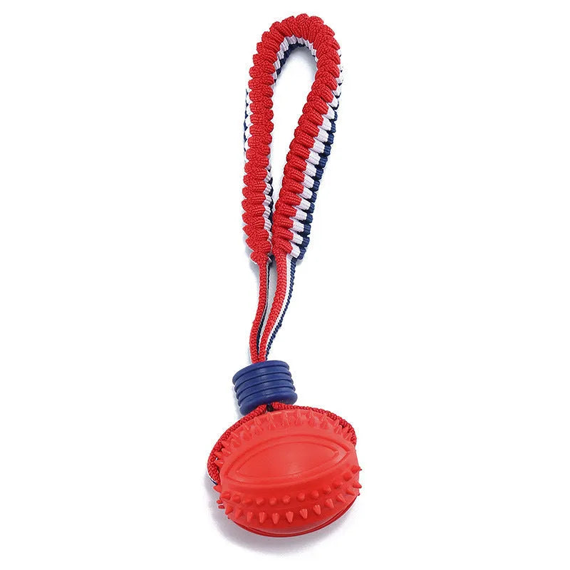 Blue or red natural rubber dog ball with attached rope for tug-of-war and teeth cleaning