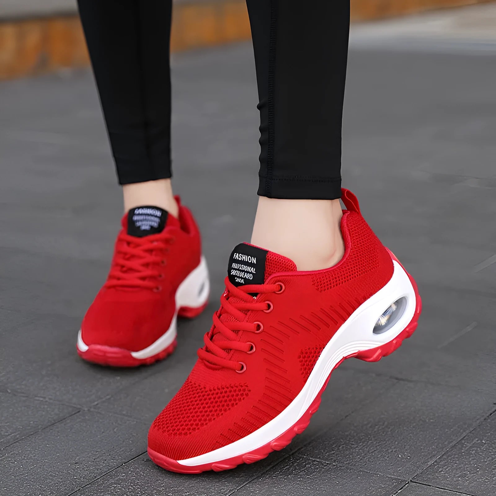 Red women's mesh sneakers with front lace-up and round toe design for casual sports