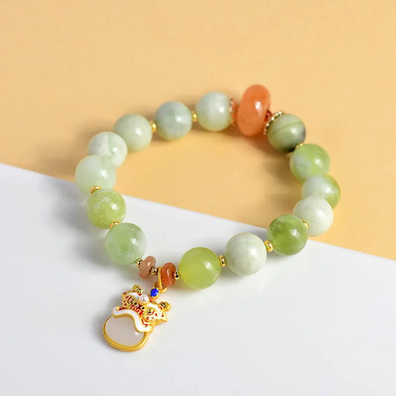 Green milk-in-water jade bracelet with 10mm geometric pendant in retro Xingshi design
