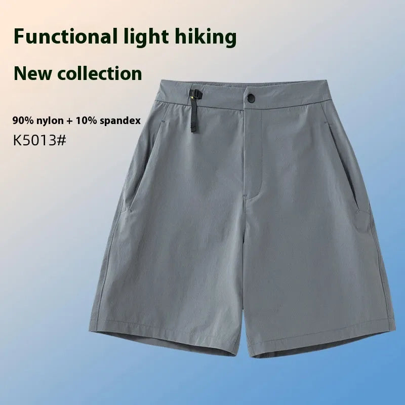 Men's solid colour quick-drying sports shorts with elastic waist, shown in army green.
