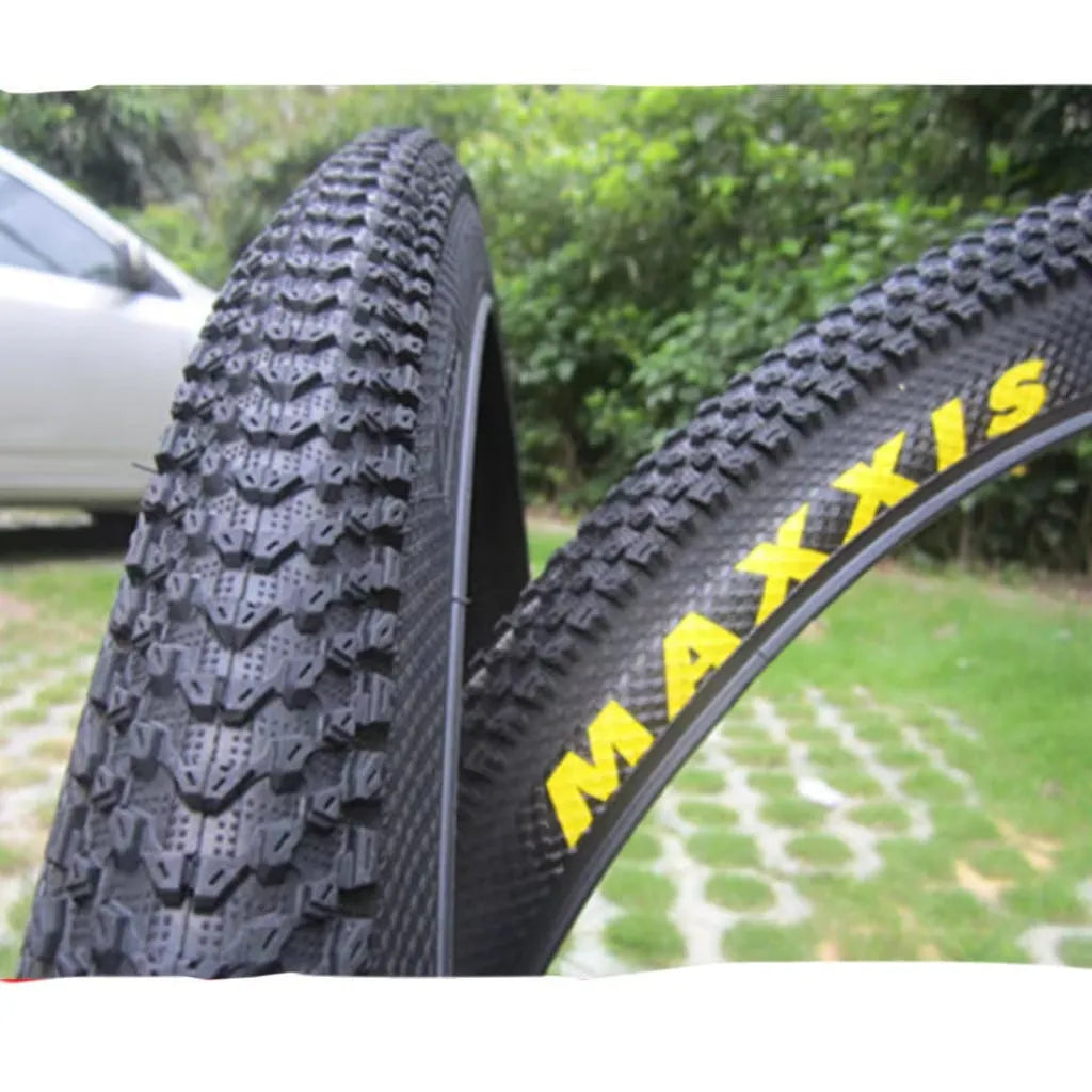 Ultralight mountain bike tyre with black tread, shown in 26, 27.5 and 29 inch sizes
