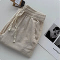 Men's loose straight casual pants in beige with drawstring waist and thin summer fabric