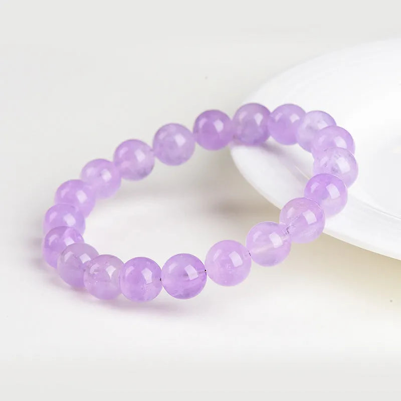 Lavender amethyst crystal bracelet with water ripple pattern on round beads in light purple colour