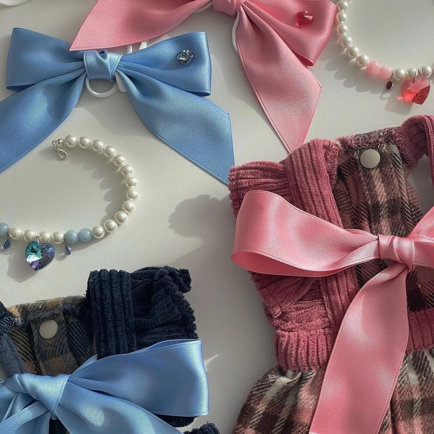 Blue princess-style dog hair band with adjustable bow on canine model