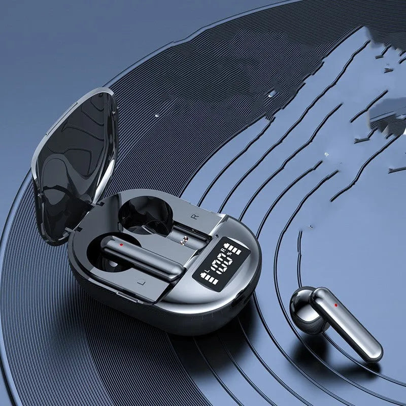 Black and white wireless Bluetooth in-ear headphones with digital display screen next to their charging case.