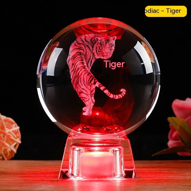 White crystal zodiac ornament with electronic luminous base showing Chinese animal design