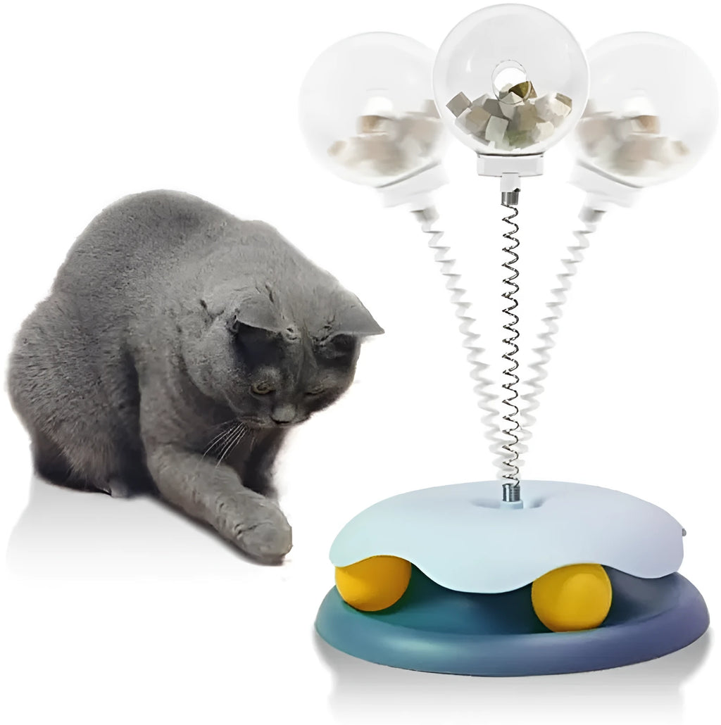 Blue or green PP plastic cat treat dispenser toy with track ball, showing slow feeder design and rounded shape.