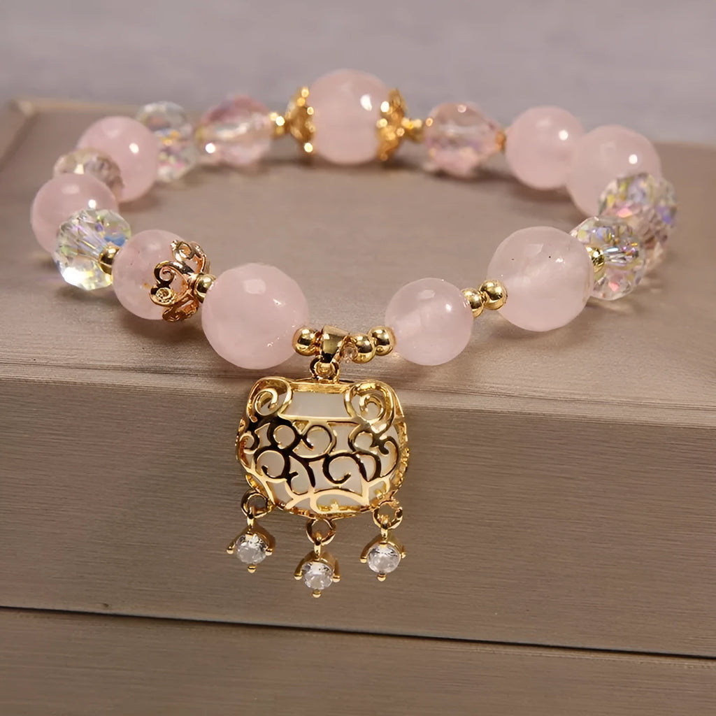 Adjustable khaki bracelet with large yellow agate bead on gold silk cord.