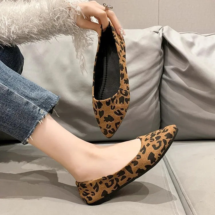 Women's leopard print pointed toe flat pumps with low heel on white background