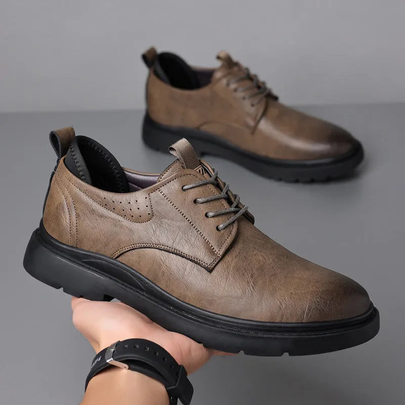 Men's black leather sneakers with rubber sole and sewing line detailing on two-layer cowhide upper