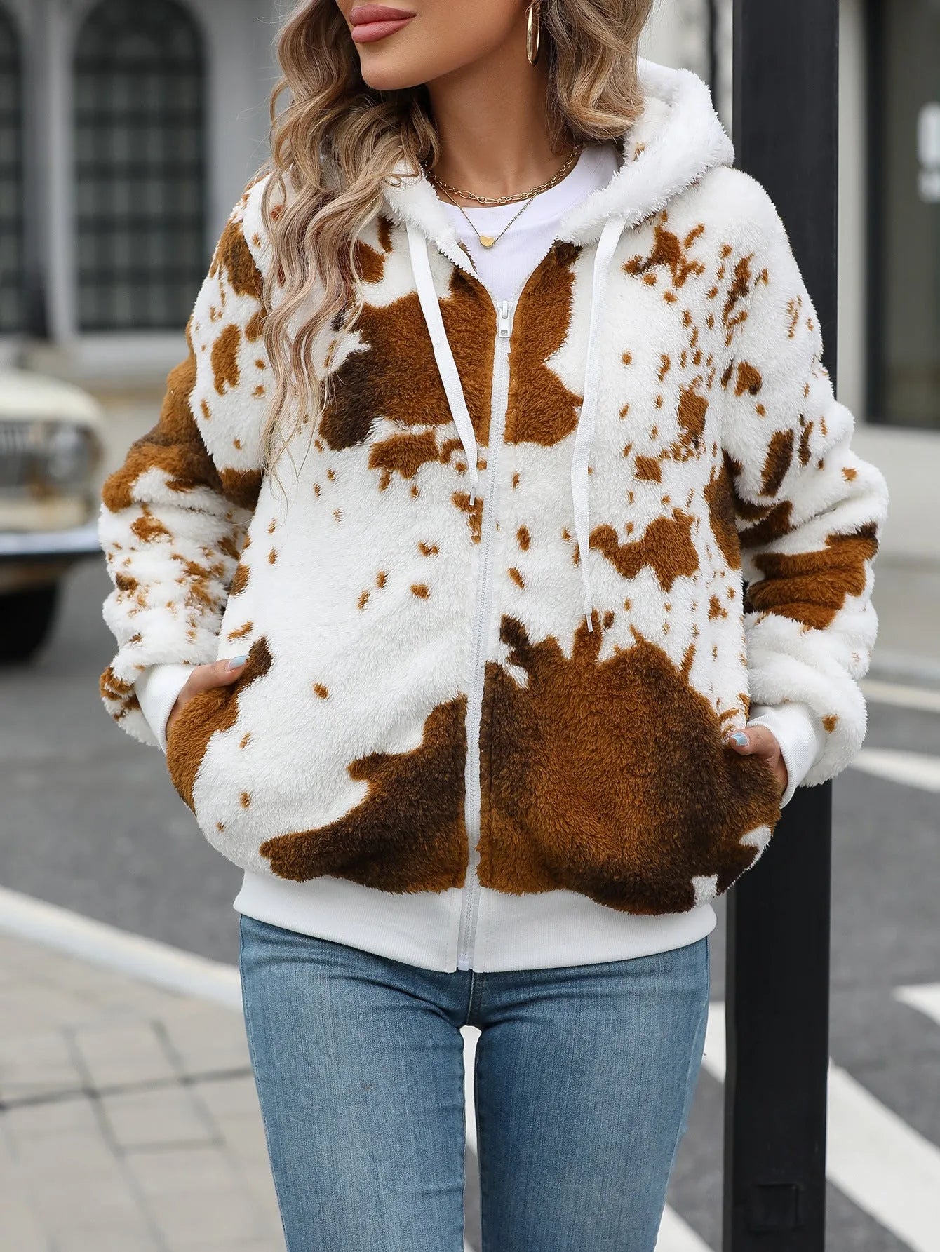 Yellow brown cow print hooded cardigan jacket with full front zipper.