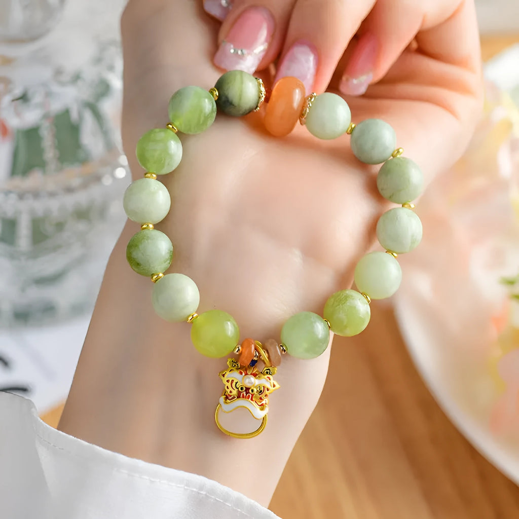 Green milk-in-water jade bracelet with 10mm geometric pendant in retro Xingshi design