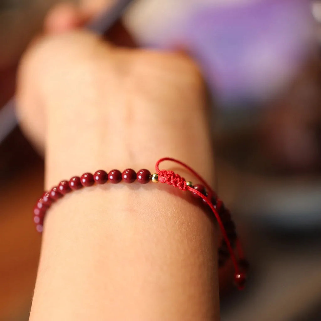 Handmade natural cinnabar bracelet with geometric auspicious patterns in purple gold sand colour