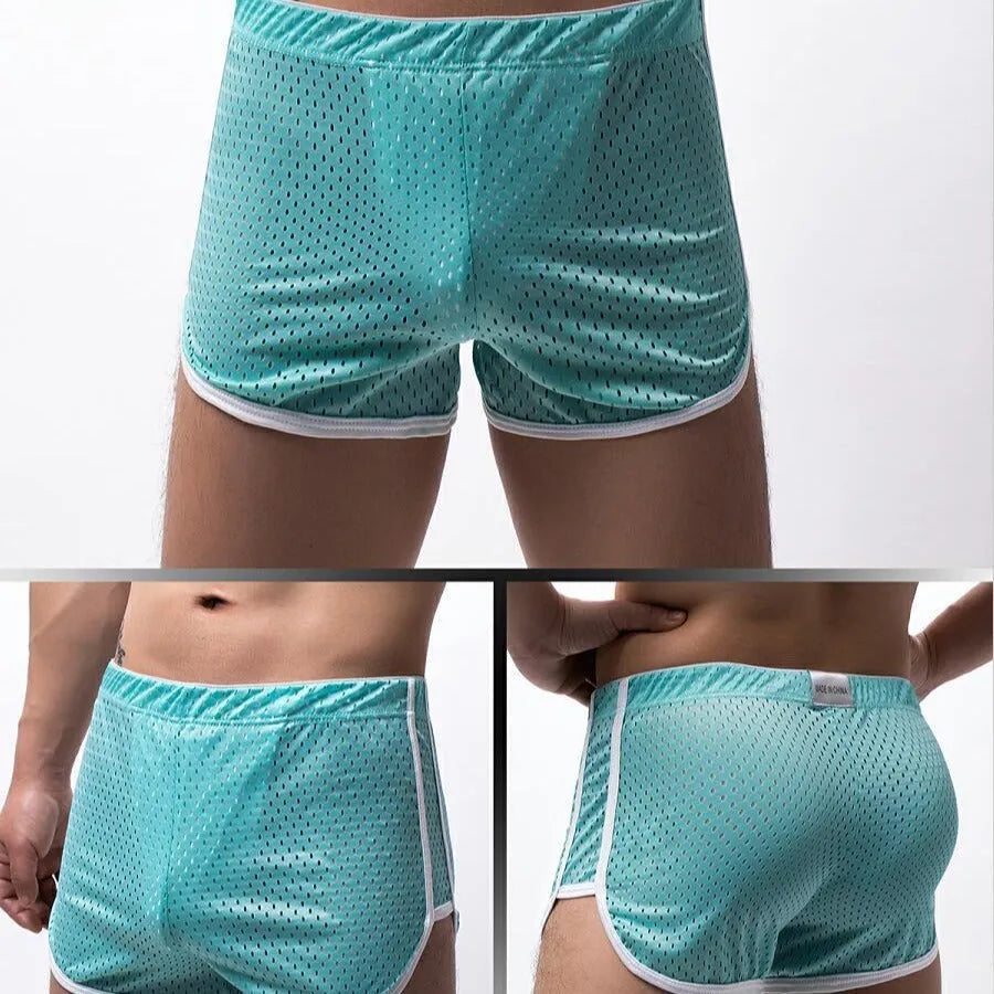 Men's grey three-point cotton boxer shorts laid flat, showing mid-waist and knitted fabric.