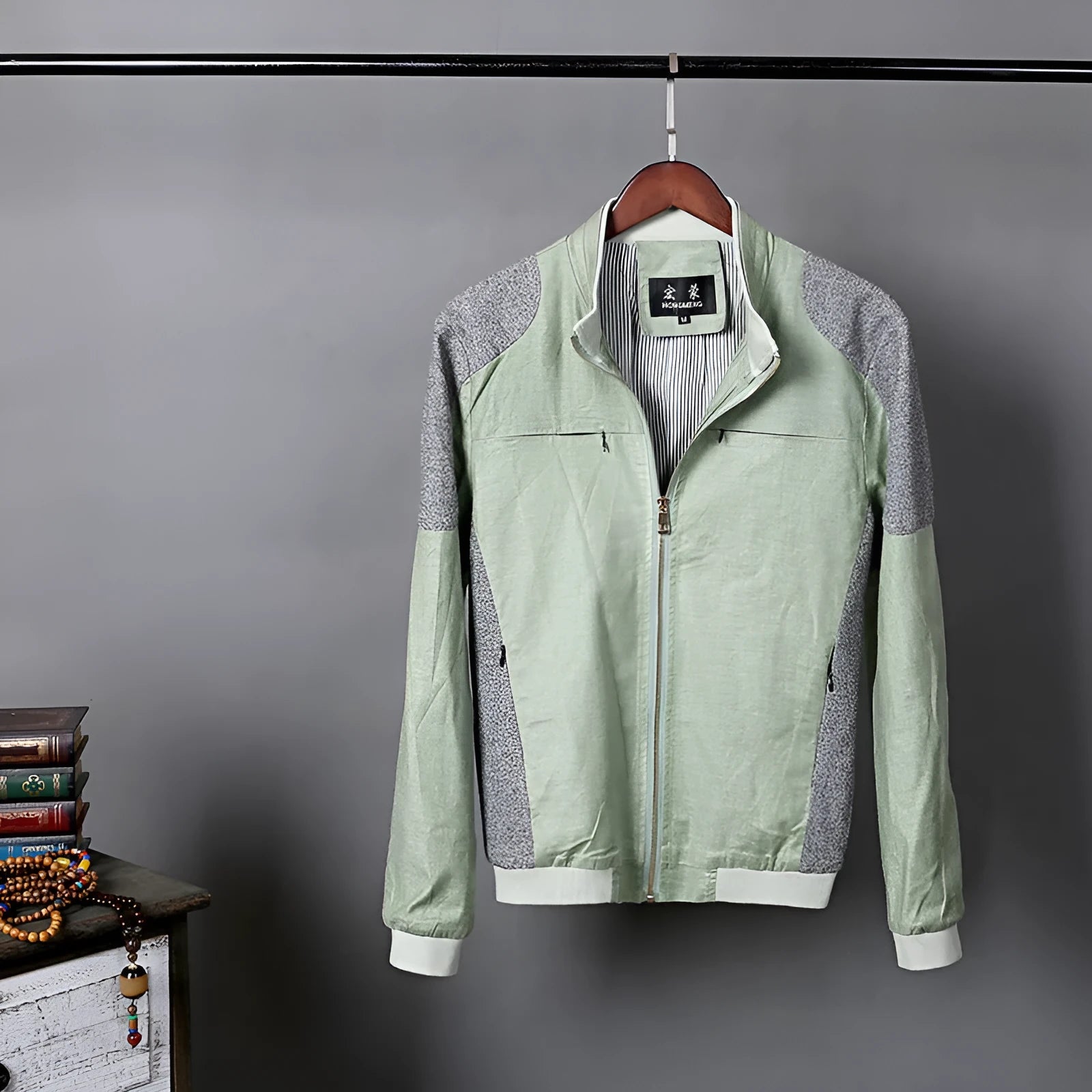 Men's blue cotton linen jacket on a hanger, showing regular fit and button front.