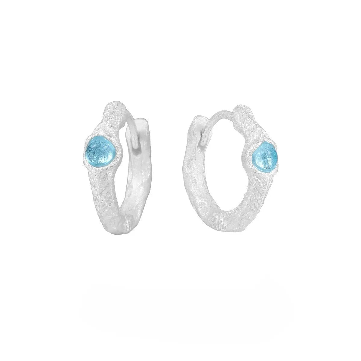 Geometric burnt silver ear clip for women, made from 925 sterling silver with a round design element.
