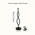 Black aluminium desk lamp with touch and button dimming controls on a desk.