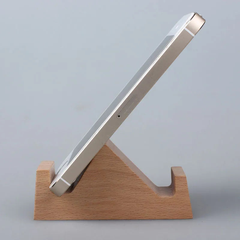 Solid beech wood mobile phone stand with a decorative resin animal ornament and a coin slot.