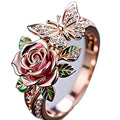 Adjustable fairy style ring with colourful oil-drip finish showing butterfly and rose motifs