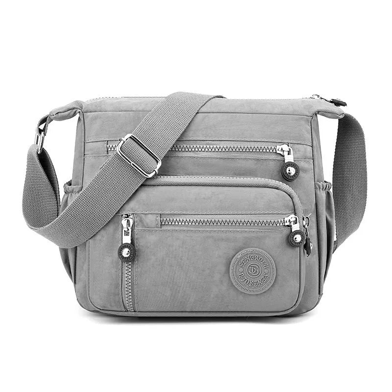 Soft nylon messenger bag with shoulder strap in square vertical shape