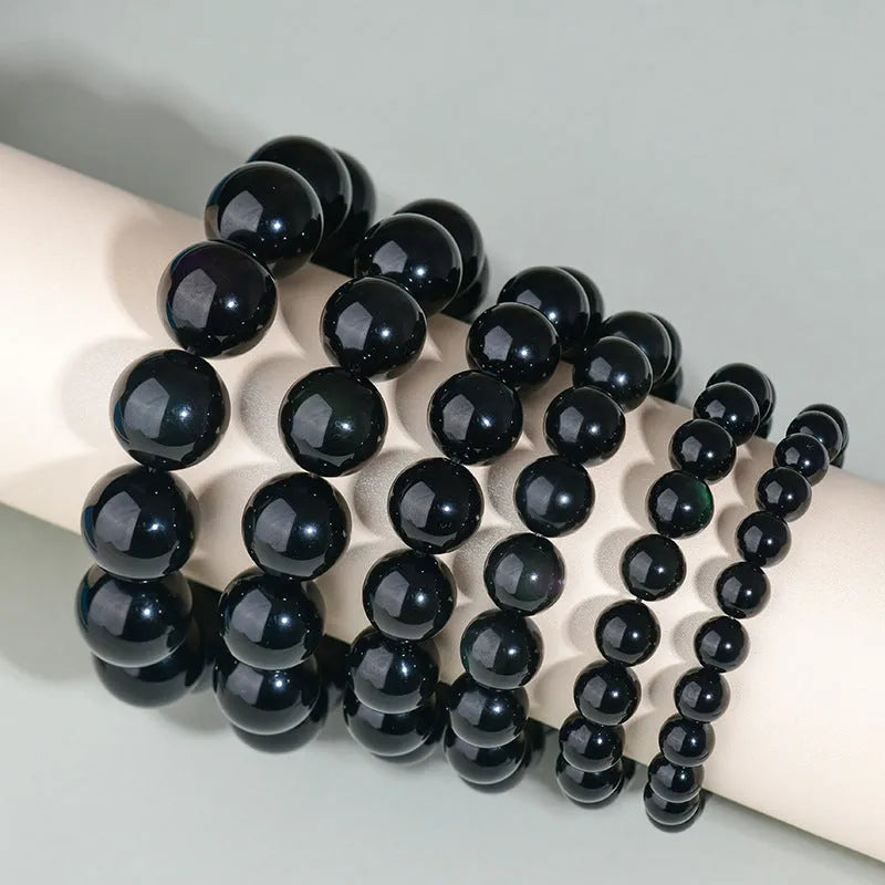 Hand-woven obsidian bracelet with round crystal beads in multiple colour options and sizes