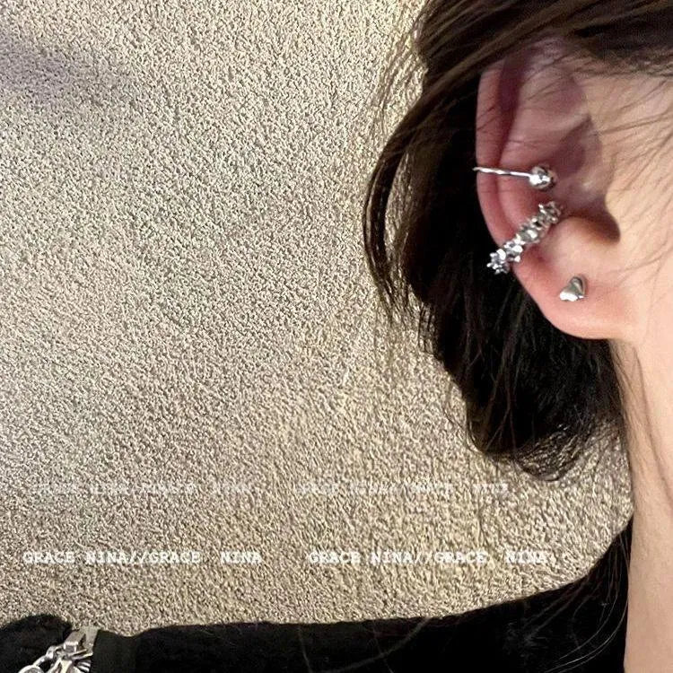 A pair of frosty B4710# coloured geometric ear clip earrings with an irregular shape.